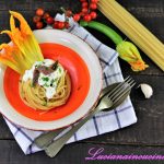 Spaghetti con stracciatella e fiori di zucchina